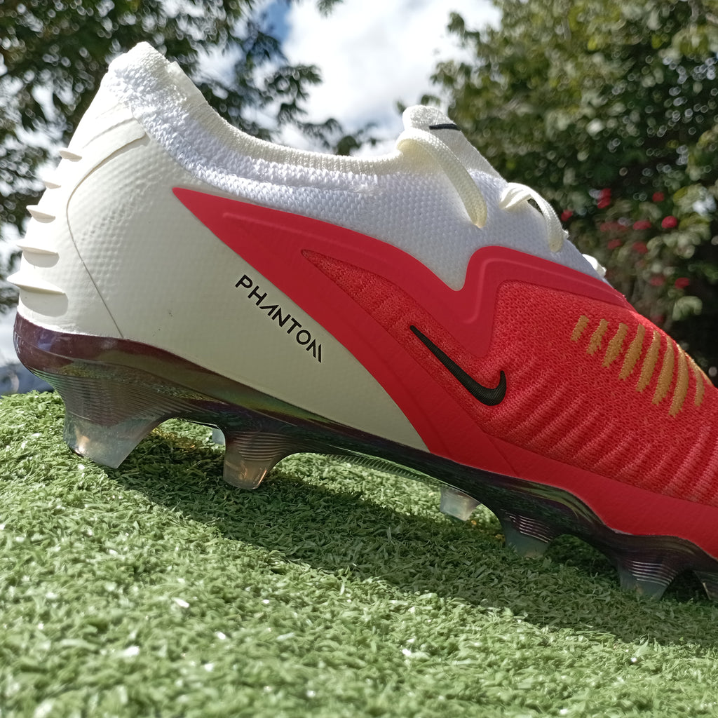 Phantom 6 Low Elite — rojo blanco (FG, césped natural)
