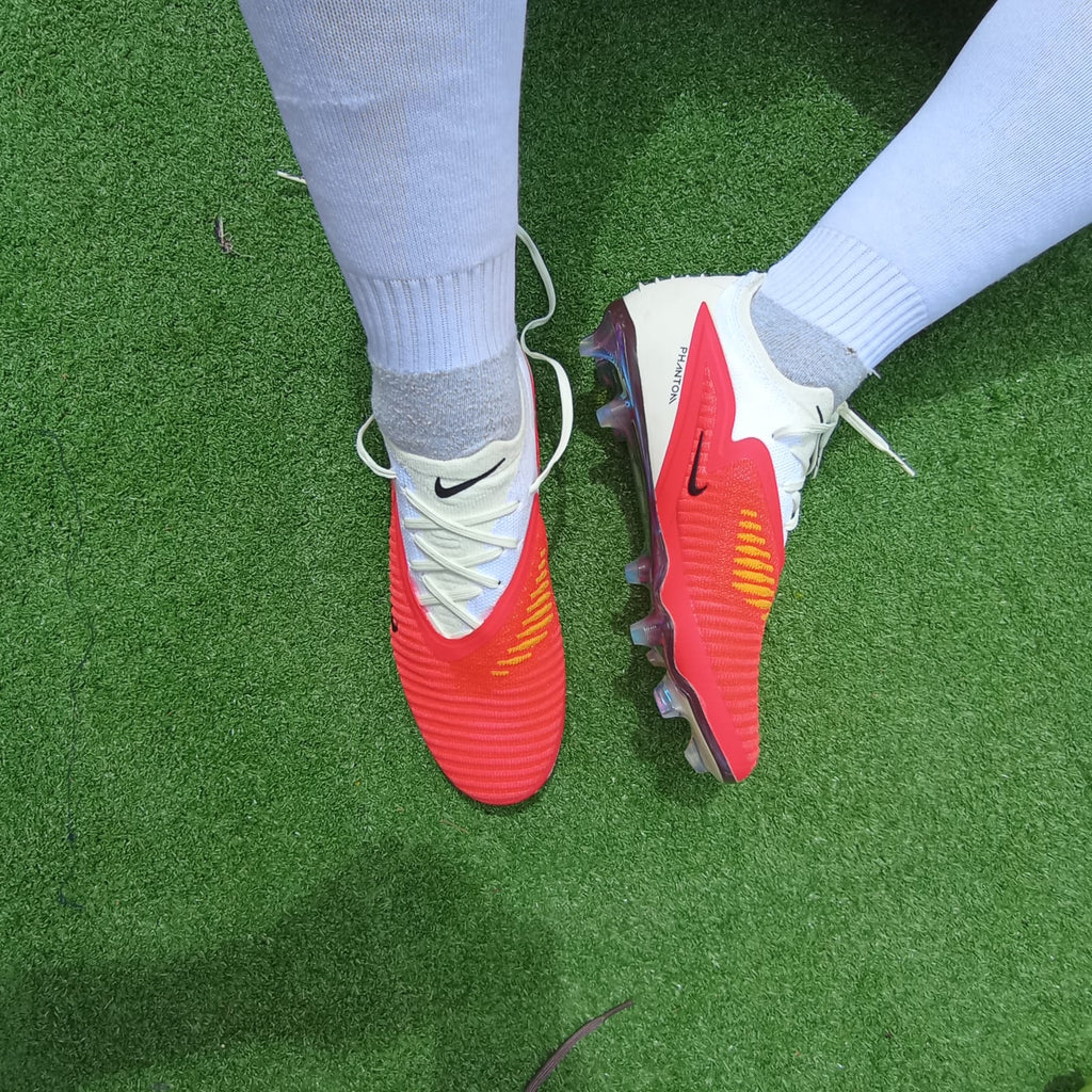 Phantom 6 Low Elite — rojo blanco (FG, césped natural)